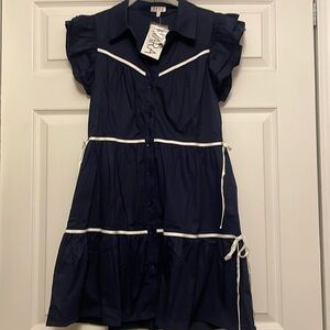 Cora dress size medium. Navy blue with white bow detail and flutter sleeve. NWT.